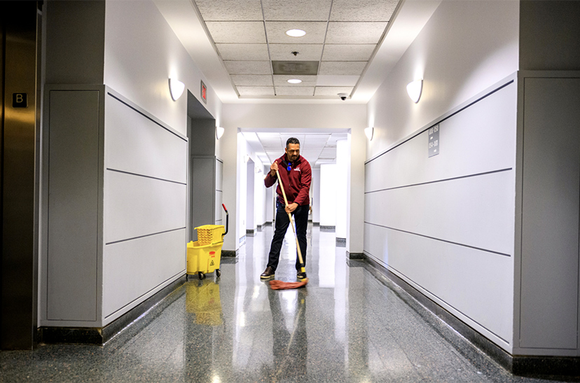 janitor cleaning a campus
